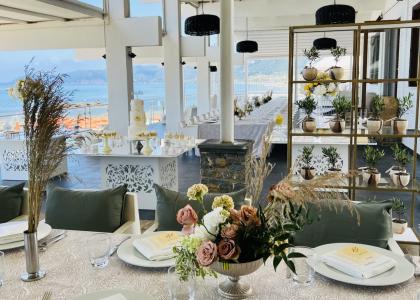 Detail of the wedding setup and the imperial table for a wedding by the sea.