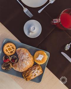 A sweet breakfast with cakes and baked goods.