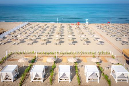 Resort beach, between crystal clear sea and coastal landscapes.